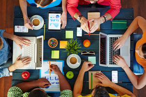 Overhead view of people working together at a table