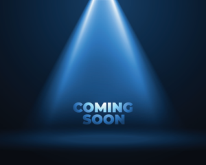 Image of a light shining down on the words that say coming soon.