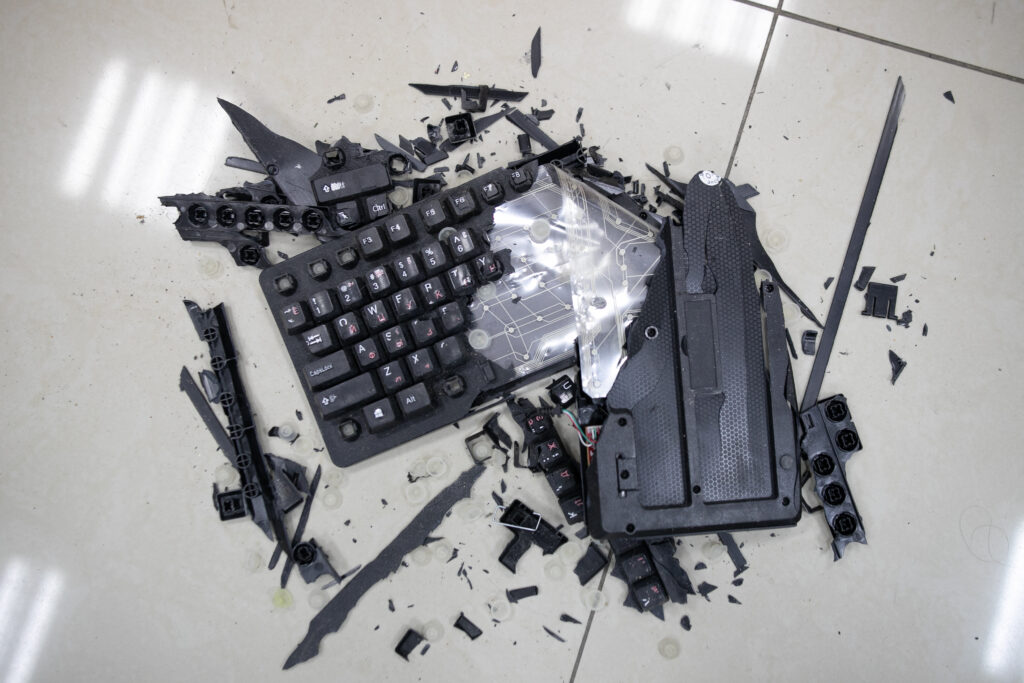 Broken keyboard on the floor.